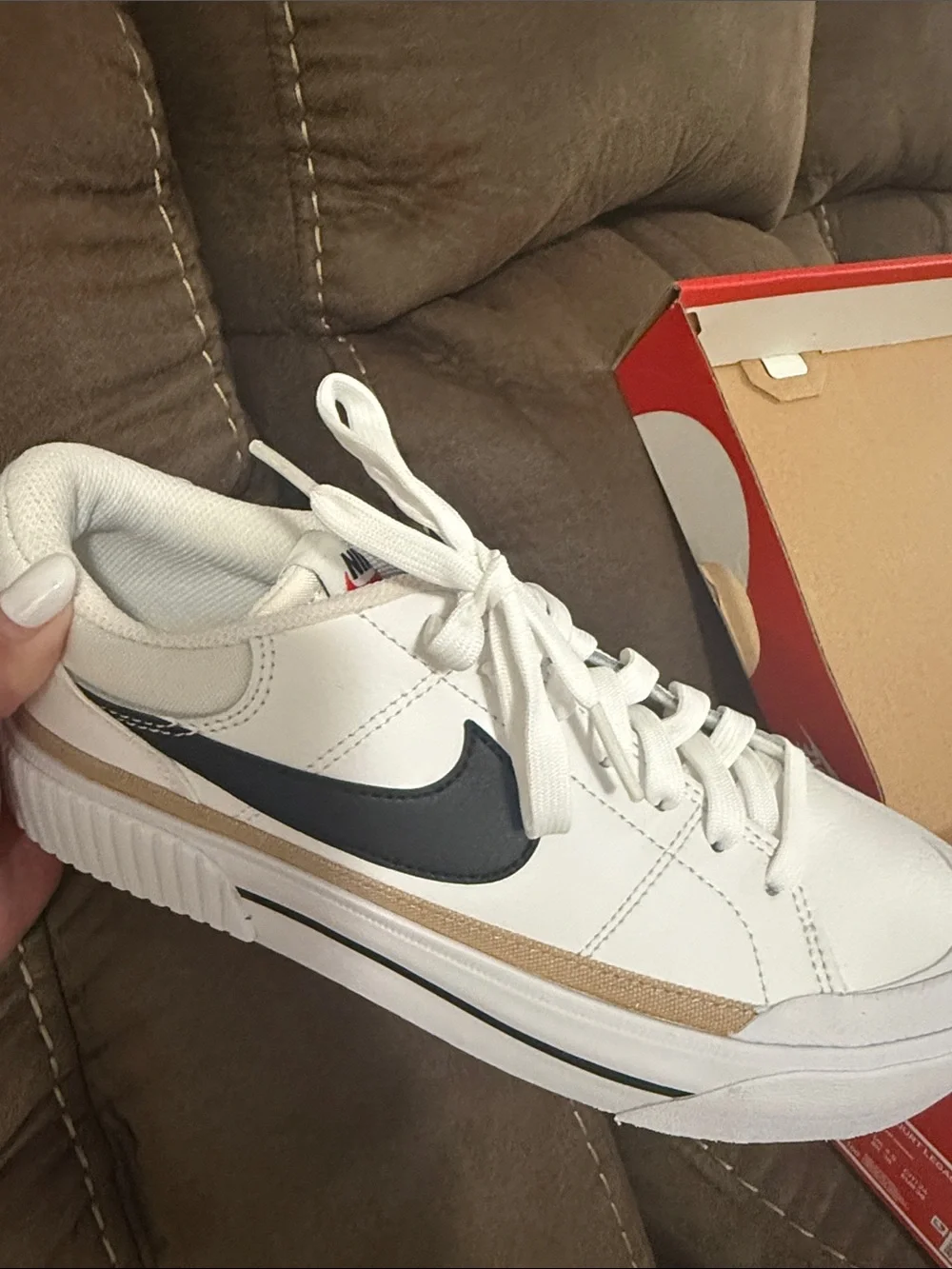 Nike Women's White Sneakers with Black Swoosh and Tan Stripe
